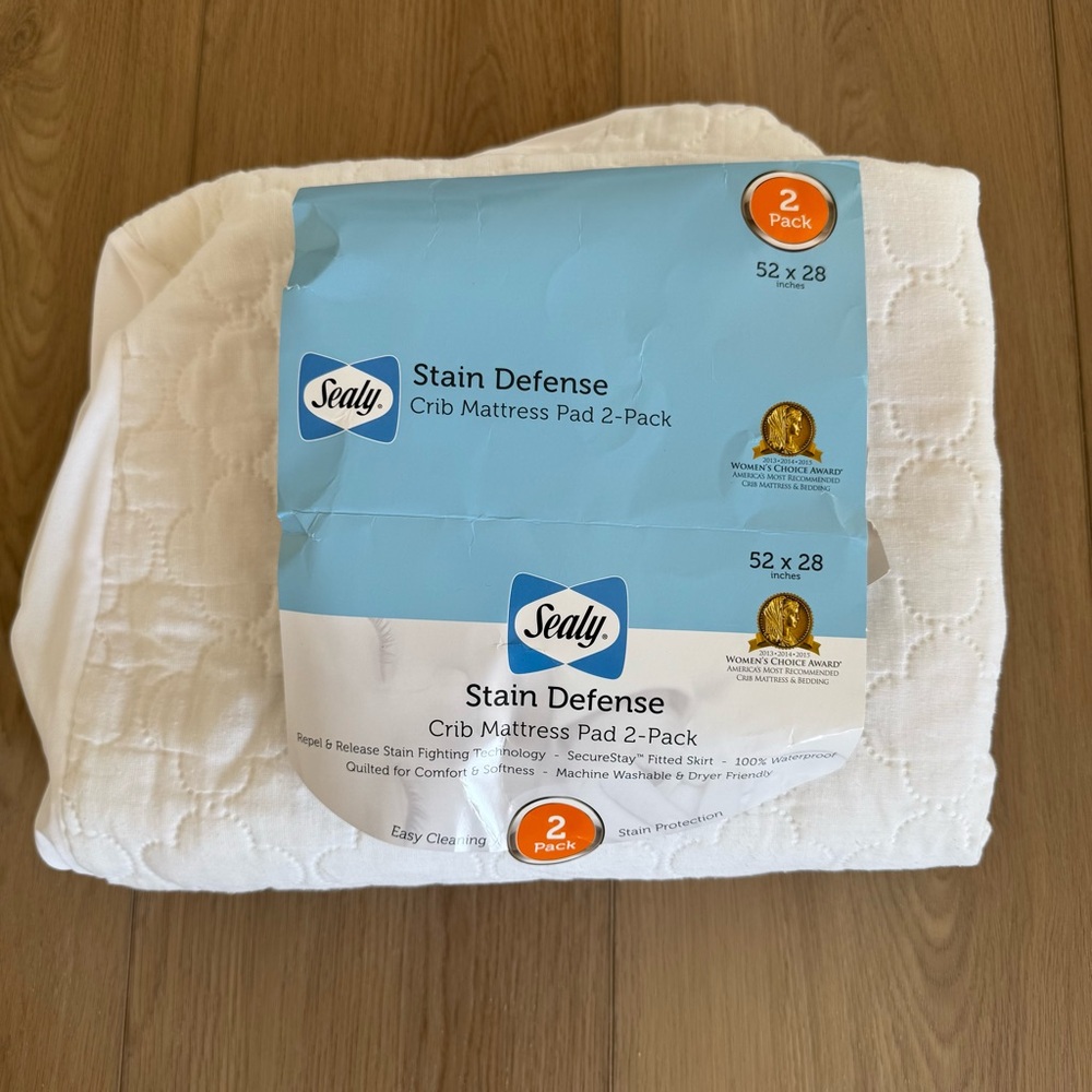 Sealy White Crib Mattress Pad (one)